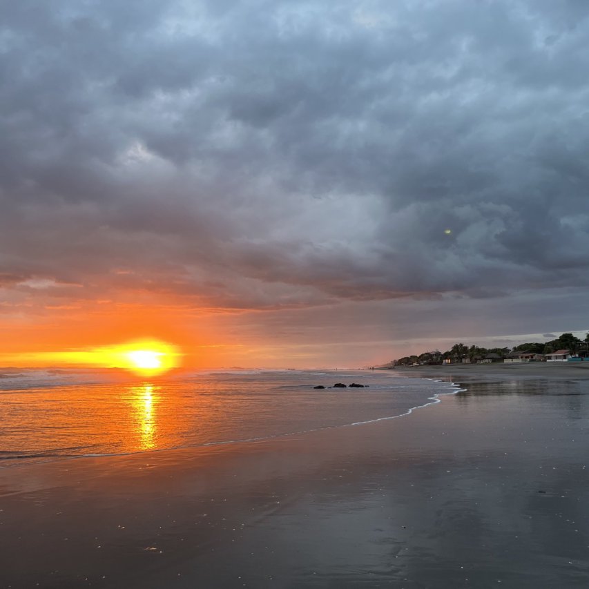 Cloudy evening sunset looking north on Playa Las Penitas